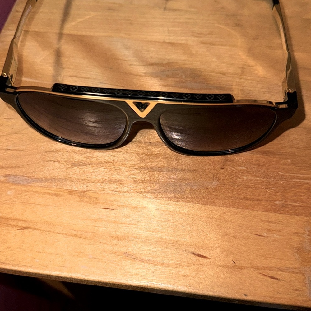 Black and gold Louis Vuitton sunglasses